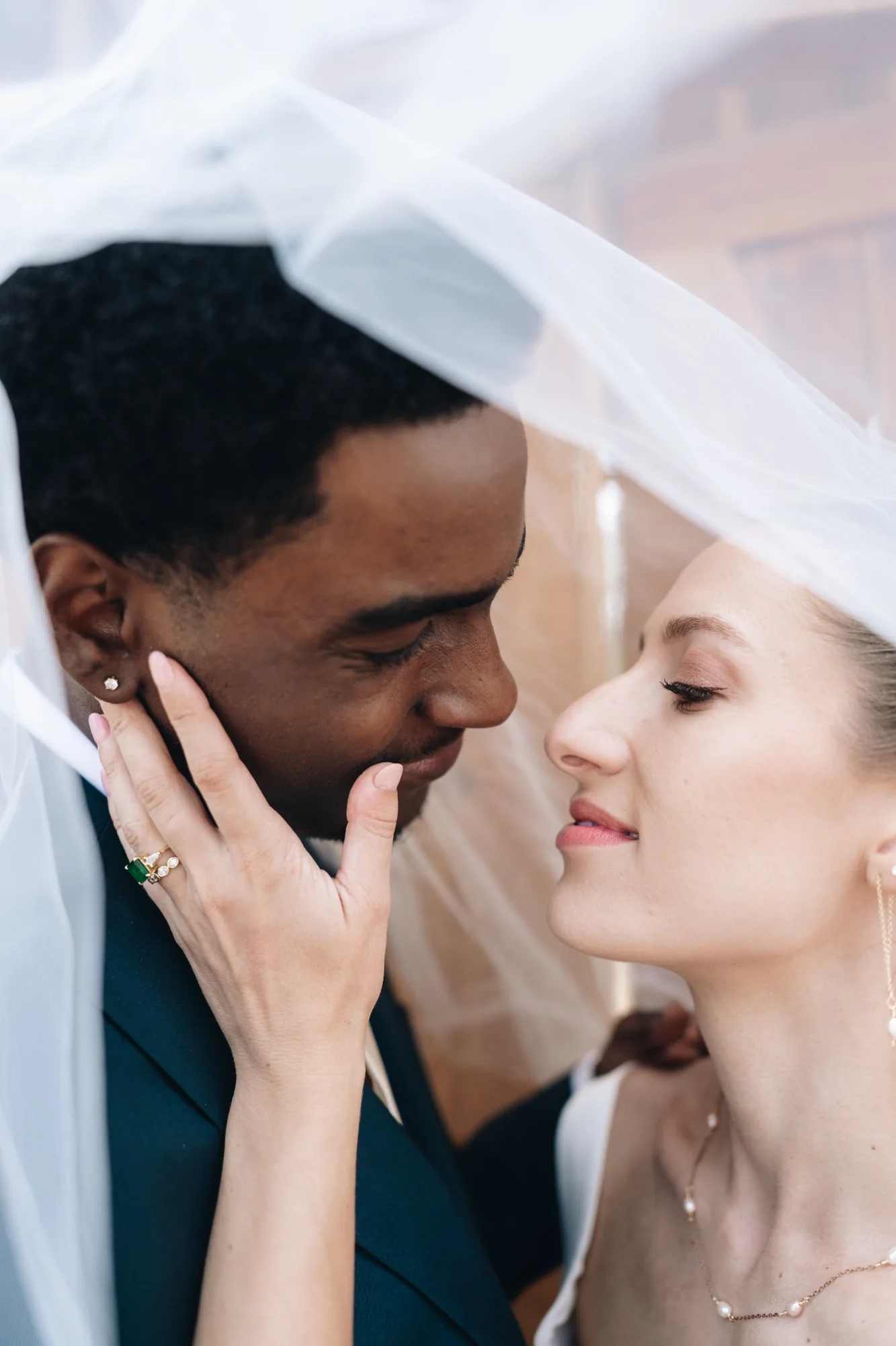 Intimate portrait of Isabella and Tim beneath the bride's veil after their Colorado elopement