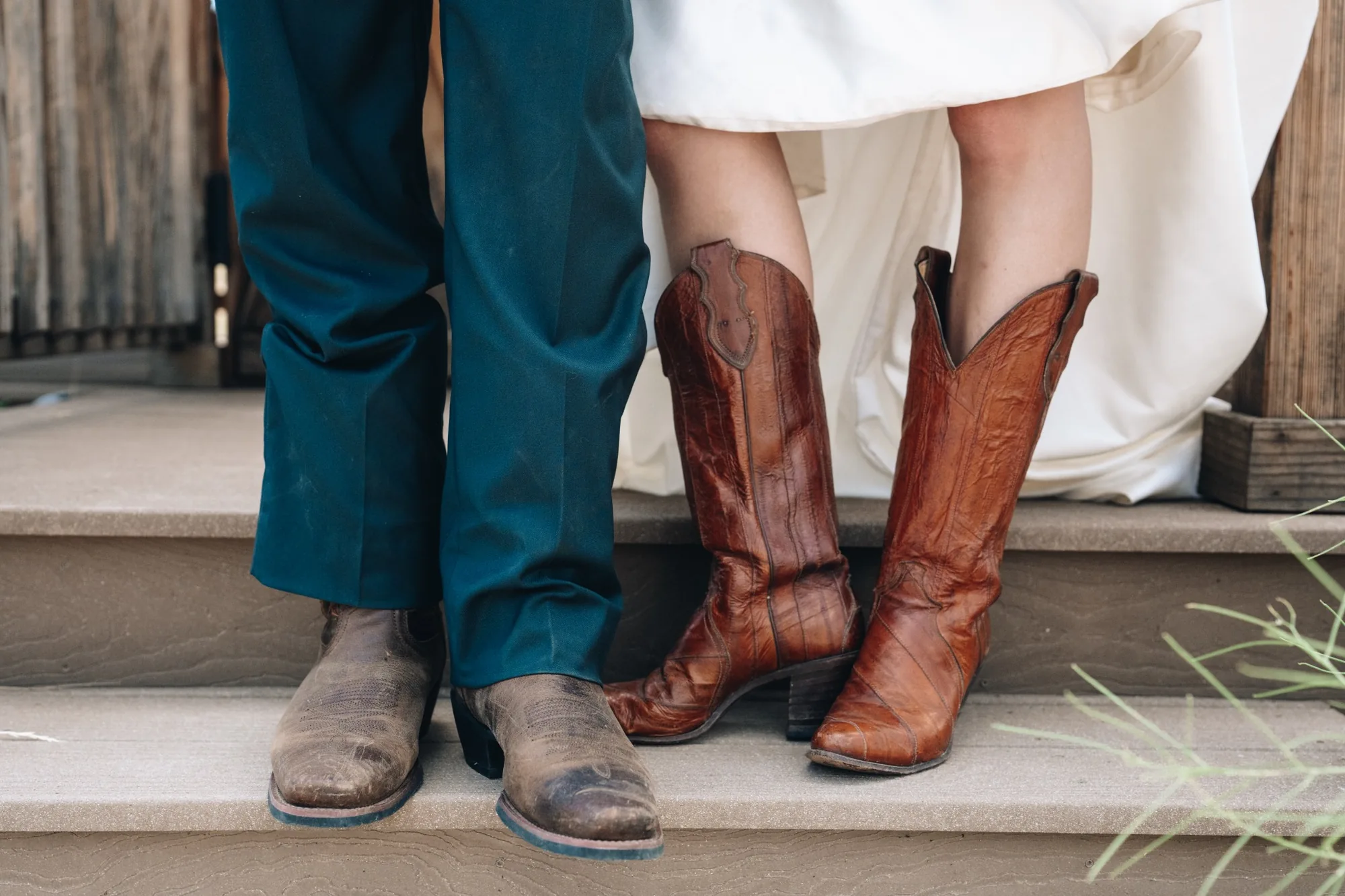 Bride and groom wearing cowboy boots during their horseback elopement at Sundance Trail Guest Ranch